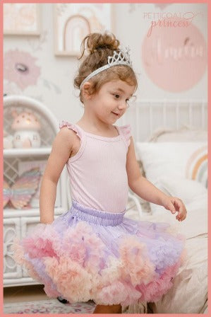 Girl wearing soft pastel lilac rainbow tutu skirt