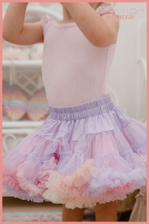 Girl wearing soft pastel lilac rainbow tutu skirt