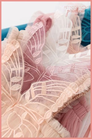 peach, pink, white and teal butterfly wing tulle dresses